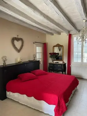 Un ou plusieurs lits dans un hébergement de l'établissement SUITE ROMANTIQUe