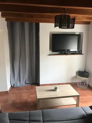 Télévision ou salle de divertissement dans l'établissement Maison de charme