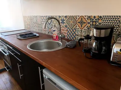 Cuisine ou kitchenette dans l'établissement L'Arbre