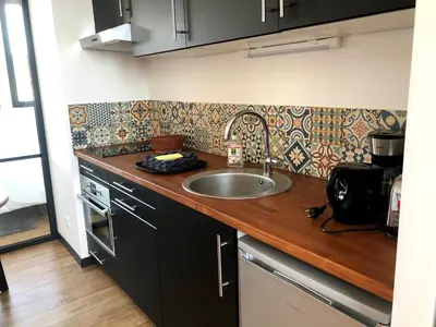 Cuisine ou kitchenette dans l'établissement L'Arbre