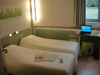 Un ou plusieurs lits dans un hébergement de l'établissement ibis budget Châtellerault Nord