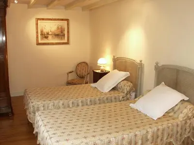 Un ou plusieurs lits dans un hébergement de l'établissement Gîte familial confortable dans un ancien moulin avec jardin - FR-1-381-6