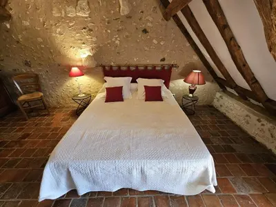 Un ou plusieurs lits dans un hébergement de l'établissement Gîte de charme en Touraine du Sud, jardin clos, 3 chambres - FR-1-381-321