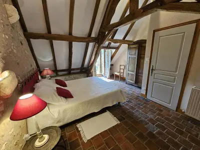 Un ou plusieurs lits dans un hébergement de l'établissement Gîte de charme en Touraine du Sud, jardin clos, 3 chambres - FR-1-381-321