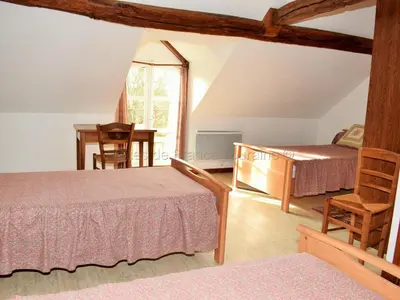 Un ou plusieurs lits dans un hébergement de l'établissement Maison de caractère avec jardin, climatisation et vélos près d'Amboise - FR-1-381-357