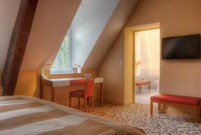 Un ou plusieurs lits dans un hébergement de l'établissement Maison d'hôtes Le Manoir de Contres