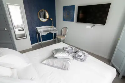 Un ou plusieurs lits dans un hébergement de l'établissement Oasis Anjou