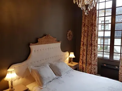 Un ou plusieurs lits dans un hébergement de l'établissement Hotel Particulier Robin Quantin