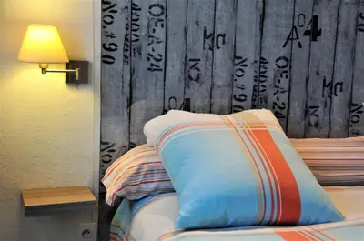 Un ou plusieurs lits dans un hébergement de l'établissement Hôtel Saint Jean