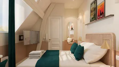 Un ou plusieurs lits dans un hébergement de l'établissement Grand Hôtel Saint-Aignan
