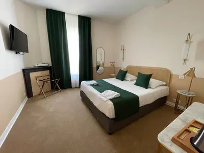 Un ou plusieurs lits dans un hébergement de l'établissement Grand Hôtel Saint-Aignan