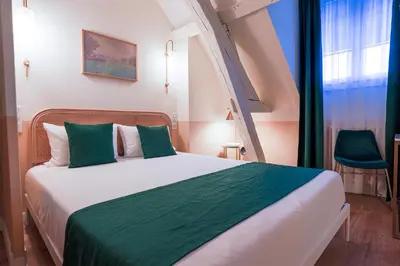 Un ou plusieurs lits dans un hébergement de l'établissement Grand Hôtel Saint-Aignan