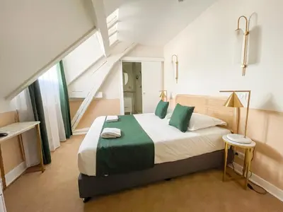 Un ou plusieurs lits dans un hébergement de l'établissement Grand Hôtel Saint-Aignan
