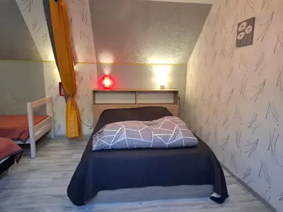 Un ou plusieurs lits dans un hébergement de l'établissement Le paradis des caves