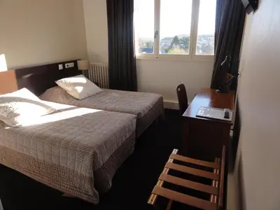 Un ou plusieurs lits dans un hébergement de l'établissement Hotel La Longue Vue