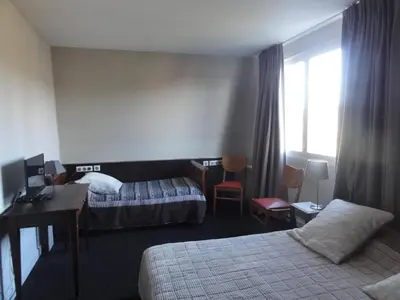 Un ou plusieurs lits dans un hébergement de l'établissement Hotel La Longue Vue