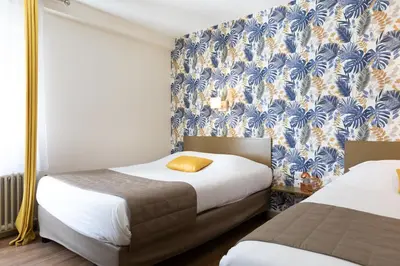 Un ou plusieurs lits dans un hébergement de l'établissement Hotel De La Pommeraie
