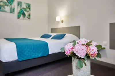 Un ou plusieurs lits dans un hébergement de l'établissement Hotel De La Pommeraie