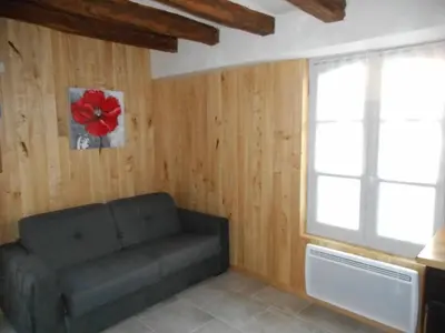 Coin salon dans l'établissement GITE DE LA PECHERIE