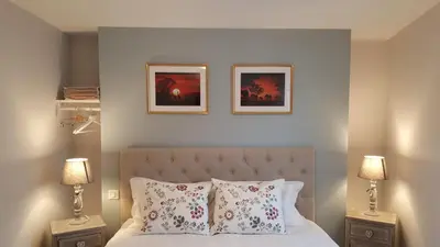 Un ou plusieurs lits dans un hébergement de l'établissement Hôtel Chez Jacqueline