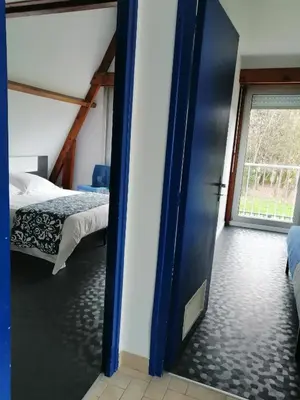 Un ou plusieurs lits dans un hébergement de l'établissement CHAMBRE INDEPENDANTE DANS UN PARC