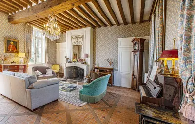 Coin salon dans l'établissement Manoir de la Voute maison d'hôtes