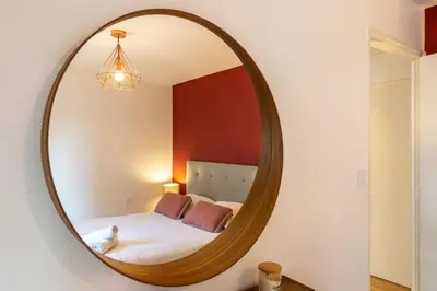 Un ou plusieurs lits dans un hébergement de l'établissement Happy Loft - Centre historique + parking privé