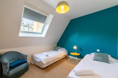 Un ou plusieurs lits dans un hébergement de l'établissement Happy Loft - Centre historique + parking privé
