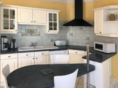 Cuisine ou kitchenette dans l'établissement Les Agapanthes site de La Riche
