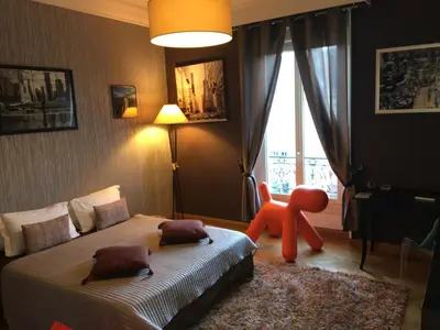 Un ou plusieurs lits dans un hébergement de l'établissement Appartements Plantagenet - Le 33