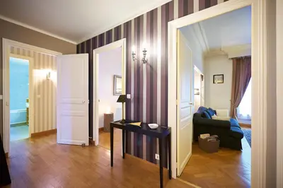 Un ou plusieurs lits dans un hébergement de l'établissement Appartements Plantagenet - Le 33