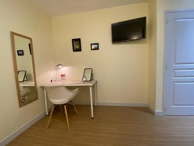 Télévision ou salle de divertissement dans l'établissement Hôtel Relais du Loir