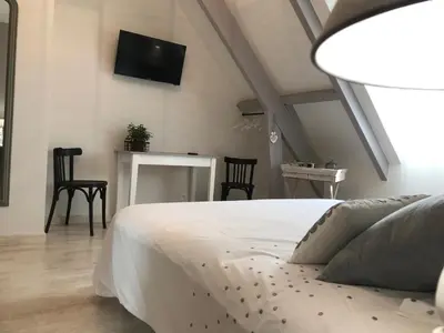Un ou plusieurs lits dans un hébergement de l'établissement Au coeur des châteaux