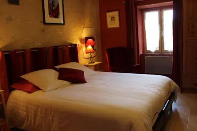 Un ou plusieurs lits dans un hébergement de l'établissement Chambres d'hôtes de la Forge