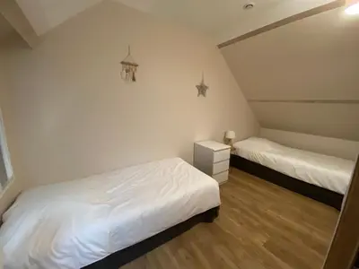 Un ou plusieurs lits dans un hébergement de l'établissement La vieille maison