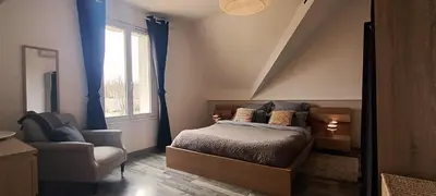 Un ou plusieurs lits dans un hébergement de l'établissement Le Clos de la Commanderie