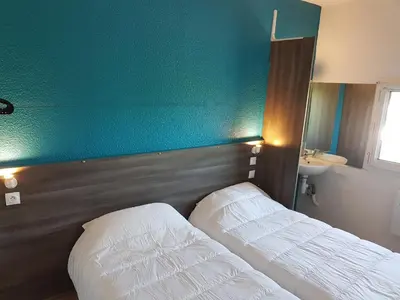 Un ou plusieurs lits dans un hébergement de l'établissement Hôtel Eco Blois -Sud- Vineuil