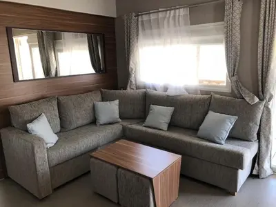 Coin salon dans l'établissement MHVACANCES LOUENT PLUSIEURS MOBILHOMES DANS CAMPING 4 ETOILES PROCHE CHATEAUX et ZOO BEAUVAL