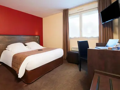Télévision ou salle de divertissement dans l'établissement Kyriad Tours - Joué-Lès-Tours
