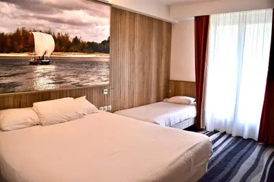 Un ou plusieurs lits dans un hébergement de l'établissement Kyriad Hotel Tours Centre
