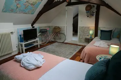 Un ou plusieurs lits dans un hébergement de l'établissement Taty Ginette Maison et Table d'Hôtes