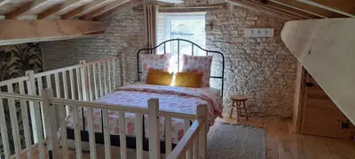 Un ou plusieurs lits dans un hébergement de l'établissement La Galuche-B&B & Studio