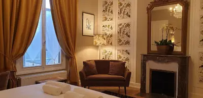 Un ou plusieurs lits dans un hébergement de l'établissement LA MAISON LEONARD