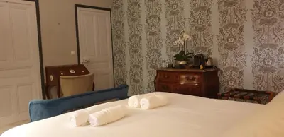 Un ou plusieurs lits dans un hébergement de l'établissement LA MAISON LEONARD