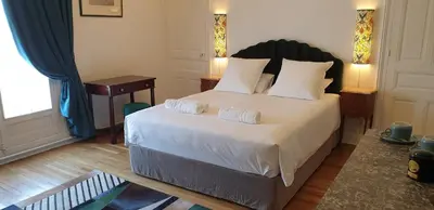 Un ou plusieurs lits dans un hébergement de l'établissement LA MAISON LEONARD