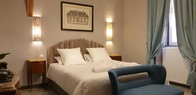 Un ou plusieurs lits dans un hébergement de l'établissement LA MAISON LEONARD