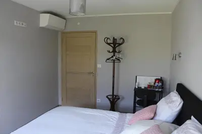 Un ou plusieurs lits dans un hébergement de l'établissement B&B La Lyre