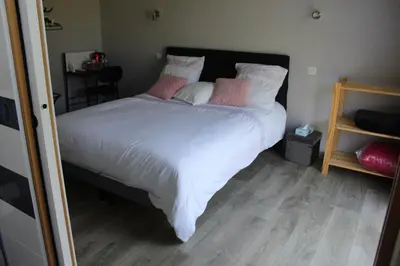 Un ou plusieurs lits dans un hébergement de l'établissement B&B La Lyre