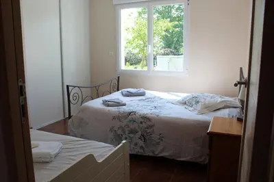 Un ou plusieurs lits dans un hébergement de l'établissement B&B La Lyre
