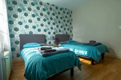 Un ou plusieurs lits dans un hébergement de l'établissement Maison aux portes de Beauval